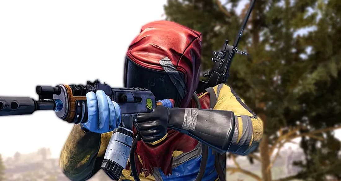 A Rust player in a yellow suit holding an assault rifle